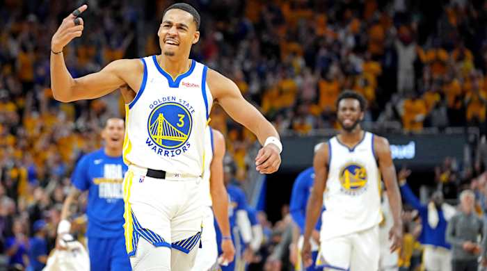 Warriors guard Jordan Poole reacts after making a last second shot at the end of the third quarter.